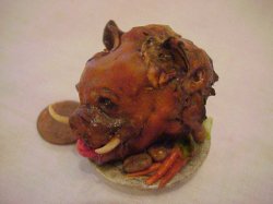 Boar's Head on porcelain platter with vegetables